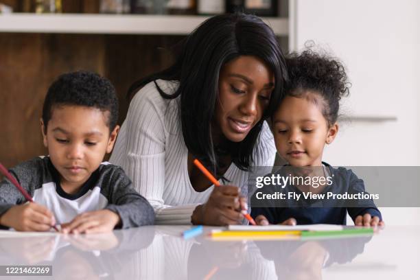 a patient mother homeschool during a pandemic - family drawing stock pictures, royalty-free photos & images