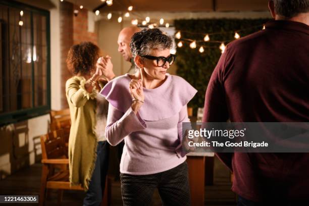 senior couple dancing at outdoor party - outdoor party imagens e fotografias de stock