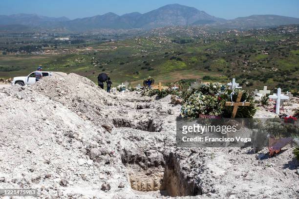 General view of Panteon número 13 municipal cemetery during a burial of a victim of COVID-19 on April 27, 2020 in Tijuana, Mexico. Baja California...
