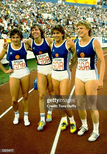 Silke Gladisch, Marita Koch, Marlies Gohr and Auerswald of the East German 4 x 100 metres Relay team celebrate after their victory during the...