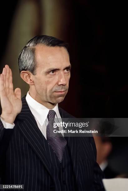 Justice David Souter raises his right hand as he is sworn in by Chief Justice of the United States William Rehnquist during a ceremony in the East...