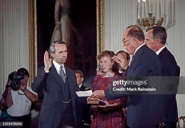 Judge David Souter with his right hand raised as Chief Justice of the United States William Rehnquist delivers the oath of office. Erin Rath daughter...
