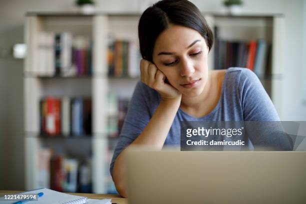 bored woman working from home - bores stock pictures, royalty-free photos & images