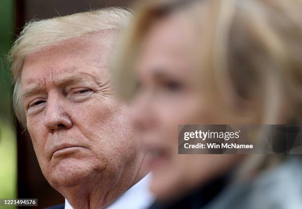 President Donald Trump listens White House coronavirus response coordinator Deborah Birx speaks during the daily briefing of the coronavirus task...