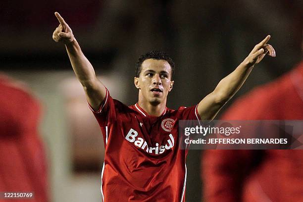 Internacional's forward Leandro Damiao celebrates after he scored the second goal against Independiente during their Recopa Sudamericana 2011 final...