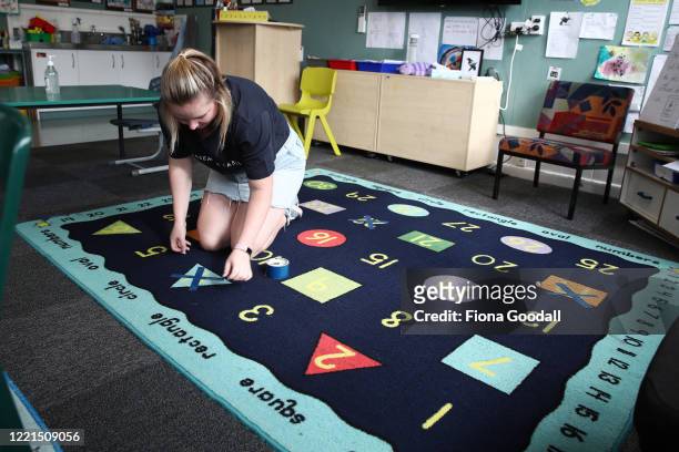 Kaipara Flats School teacher Maddy Tuffley prepares for the return of a small number of students tomorrow on April 28, 2020 in Auckland, New Zealand....