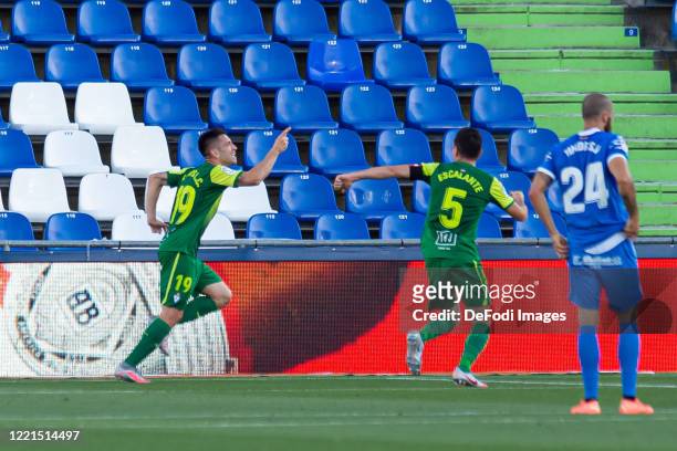 Charles Dias de Oliveira of SD Eibar celebrates after scoring his team's first goal with teammates during the Liga match between Getafe CF and SD...