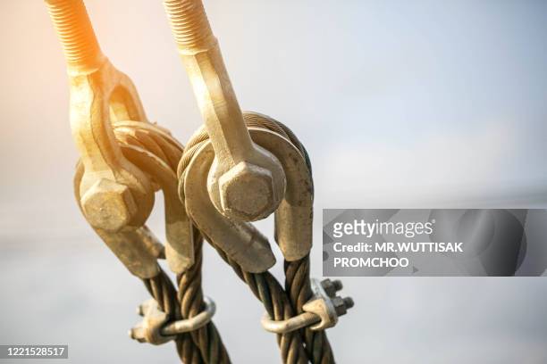 wire rope  and the nut. - cable installer stock pictures, royalty-free photos & images