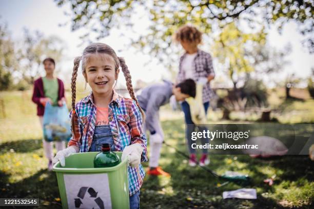 family cleaning up the forest - bottle bank stock pictures, royalty-free photos & images