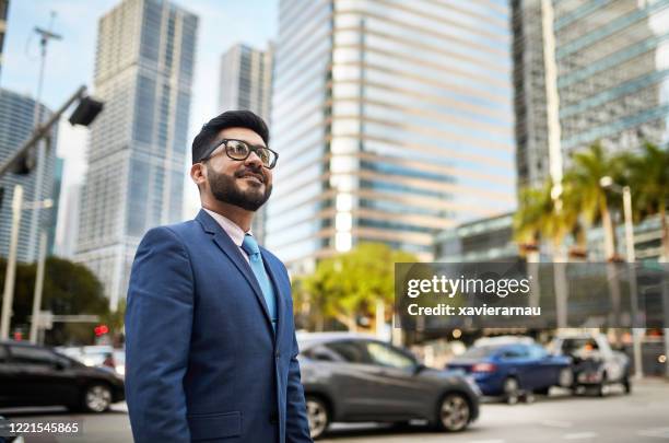 outdoor portrait of ambitious hispanic businessman in miami - miami business imagens e fotografias de stock