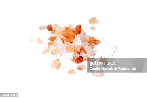 himalayan salt on white background - himalayan salt stock-fotos und bilder