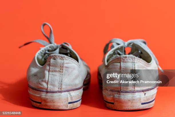 pills white pigment for on a yellow background - worn sneakers stock pictures, royalty-free photos & images