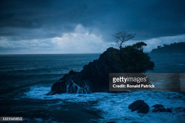 Small islet close to the shore on a stormy evening on October 2, 2012 in Utria National Park, Colombia. The Utria National Park lies in the Pacific...