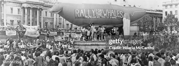 Supporters near a 400 ft inflatable whale at the 'Rally For The Whales" protest in Trafalgar Square, London, UK, 8th July 1979.