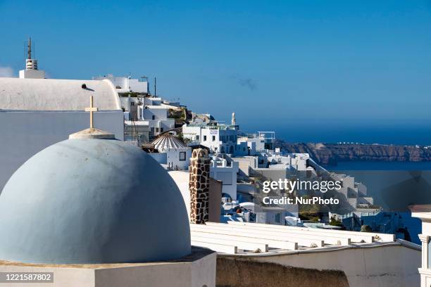 Domes on the rooftop of the Church of St. Mark the Evangelist. Famous stunning view of white panoramic architecture on the cliff and blue dome church...