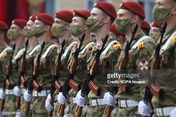 Russian military servicemen wearing face masks take part in a general rehearsal of the Victory Day parade at the Dvortsovaya Square in front of the...