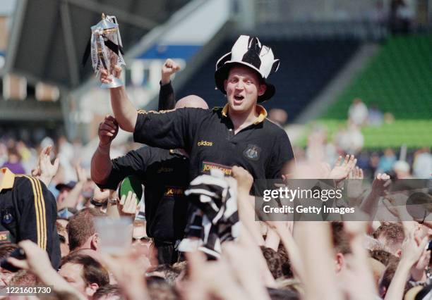Newcastle Falcons player Doddie Weir is chaired off with the trophy after the Falcons had beaten Harlequins to claim the 1997/98 Allied Dunbar...