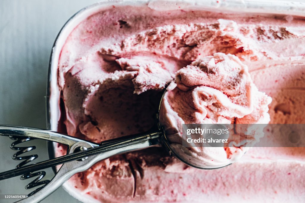Serving homemade strawberry ice cream
