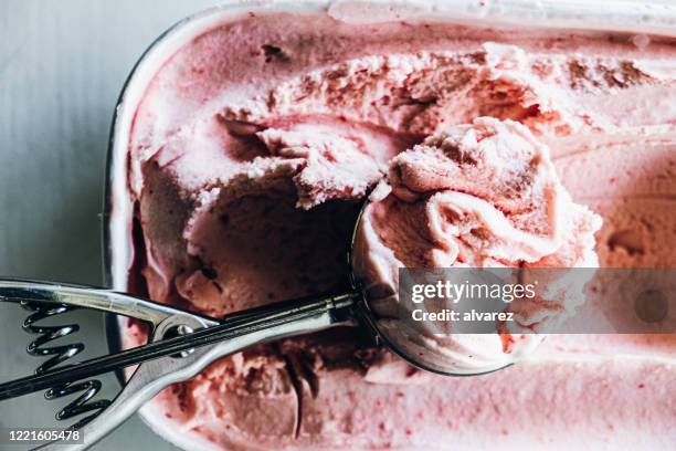 serving homemade strawberry ice cream - strawberry ice cream stock pictures, royalty-free photos & images