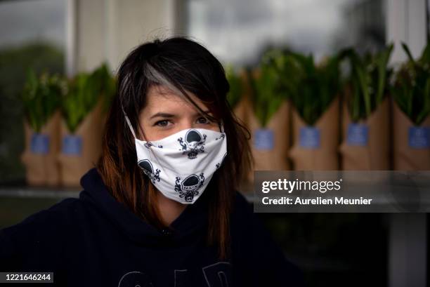 Florist is seen preparing Lily of the Valley orders in celebration of Labor Day during the Coronavirus pandemic on April 28, 2020 in La Celle Saint...