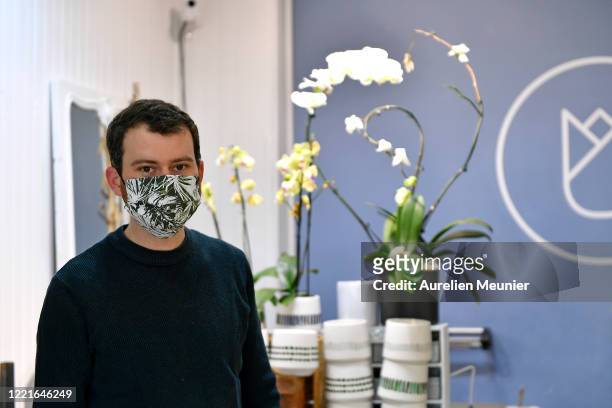 Florist is seen preparing Lily of the Valley orders in celebration of Labor Day during the Coronavirus pandemic on April 28, 2020 in La Celle Saint...