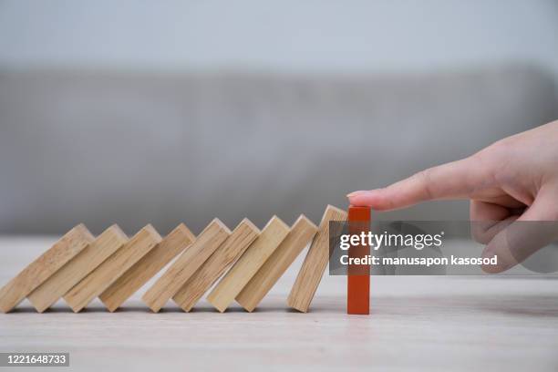 domino,wooden block,business risk, strategy and planning concept idea. - proactive stock-fotos und bilder