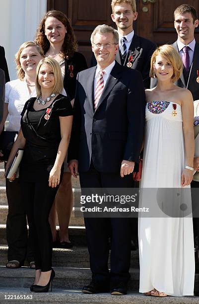Jeanette Biedermann, German President Christian Wulff and Wolke Hegenbarth pose for a family picture at Bellevue Castle on August 26, 2011 in Berlin,...