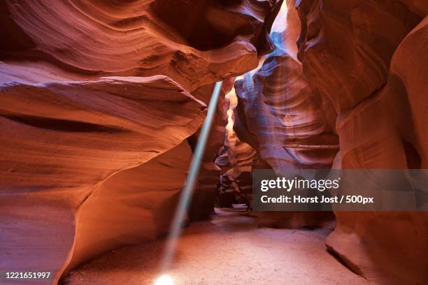 sunbeam shining inside of antelope canyon, page, arizona, usa - antelope canyon stock-fotos und bilder