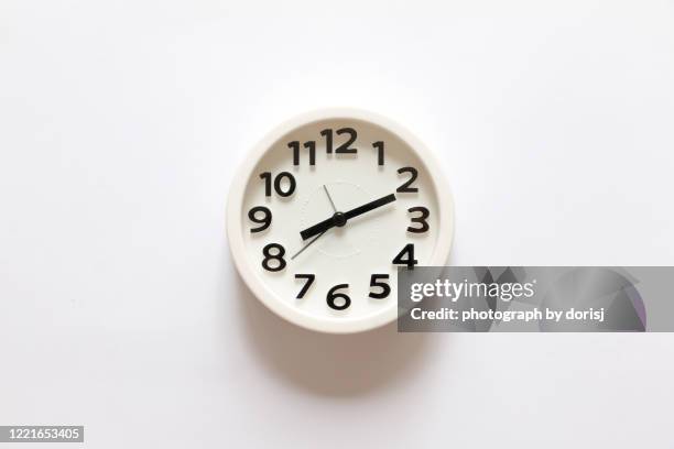 round shape white color alarm clock on white background - school data imagens e fotografias de stock