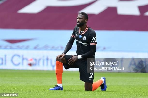 Chelsea's German defender Antonio Rudiger takes a knee to show solidarity with the Black Lives Matter movement against racism during the English...