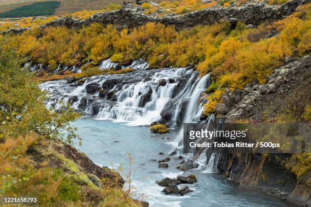 hraunfossar waterfall, borgarnes, iceland - hraunfossar stock pictures, royalty-free photos & images
