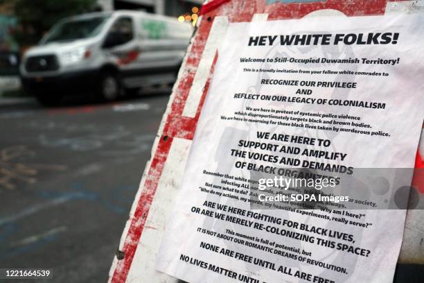 Sign describes the neighbourhood as "still occupied Duwamish territory" in the Seattles so-called Capitol Hill Autonomous Zone, or CHAZ - an area...