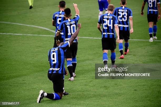 Inter Milan's Belgian forward Romelu Lukaku kneels on the pitch after opening the scoring during the Italian Serie A football match Inter vs...