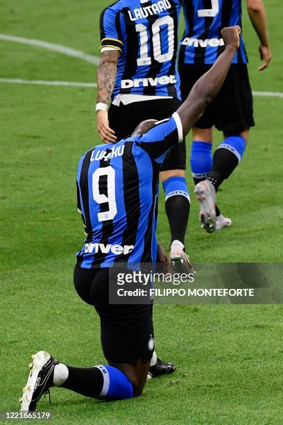 Inter Milan's Belgian forward Romelu Lukaku kneels on the pitch after opening the scoring during the Italian Serie A football match Inter vs...