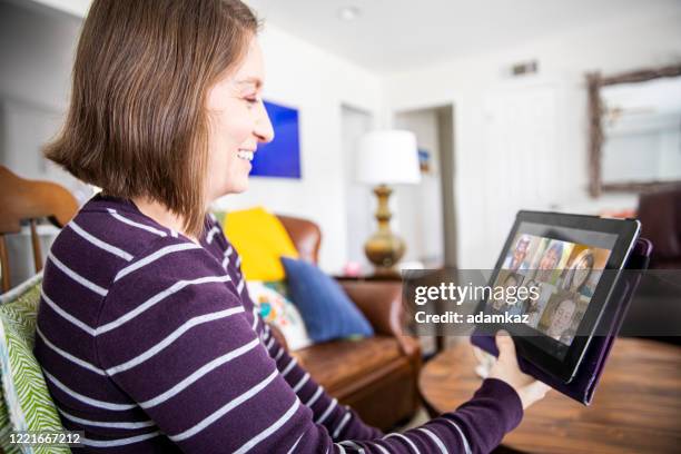 young woman video chat with friends - online church stock pictures, royalty-free photos & images