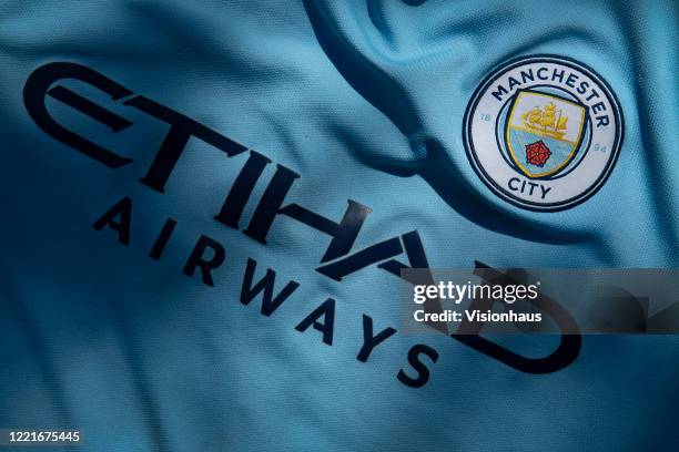 The Manchester City club crest displaying Etihad Airways as the shirt sponsor on a first team shirt on April 24, 2020 in Manchester, England