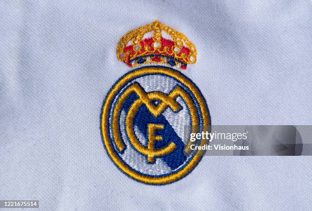 The Real Madrid club crest on a first team home shirt on April 24, 2020 in Manchester, England