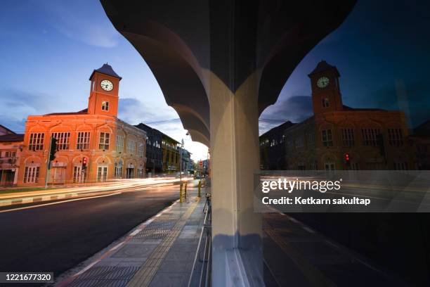 sino-portuguese architecture, clock tower of phuket, charter intersection, phuket old town. - phuket old town stock-fotos und bilder