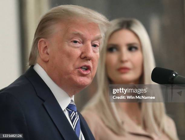 President Donald Trump delivers remarks on supporting small businesses through the Paycheck Protection Program while flanked by White House advisor...