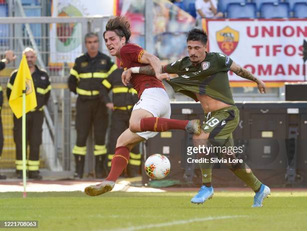 Nicolò Zaniolo of AS Roma and Fabio Pisacane of Cagliari Calcio fight for the ball during the Serie A match between AS Roma and Cagliari Calcio at...