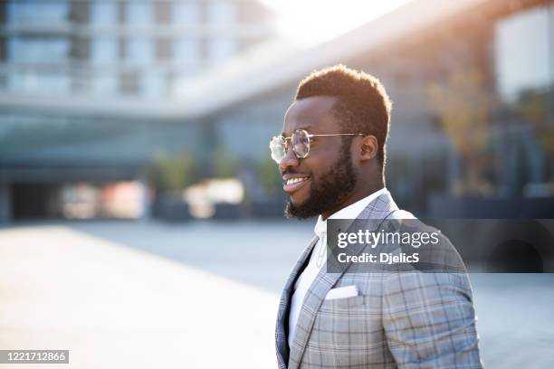 happy fashionable businessman. - man side way looking stock pictures, royalty-free photos & images