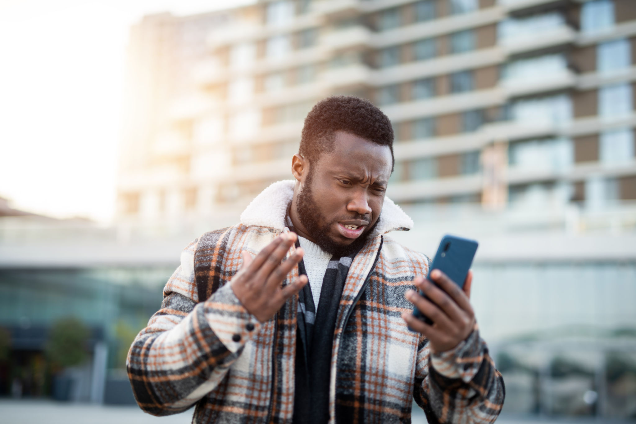 Frustrated man using a phone. Frustrated man using a phone.
