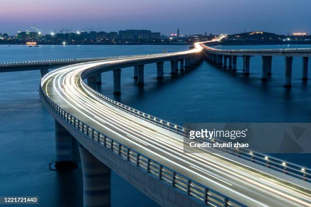 qingdao jiaozhou bay cross-sea bridge - qingdao bridge stock pictures, royalty-free photos & images