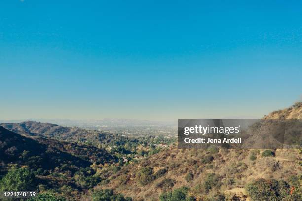 los angeles smog over san fernando valley, smoggy sky in california, view from hiking in los angeles - hollywood hill stock pictures, royalty-free photos & images