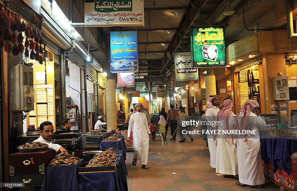 Saudi men shop at the Mecca market in ce