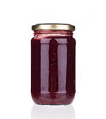 Glass jar with berry jam.