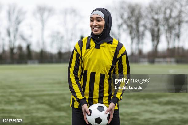 beautiful young female muslim soccer player - netherlands women football training stock pictures, royalty-free photos & images