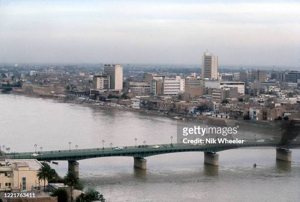 Traffic crosses bridge spanning the Tigris river in Iraqi capital city of Baghdad in 1978 ;