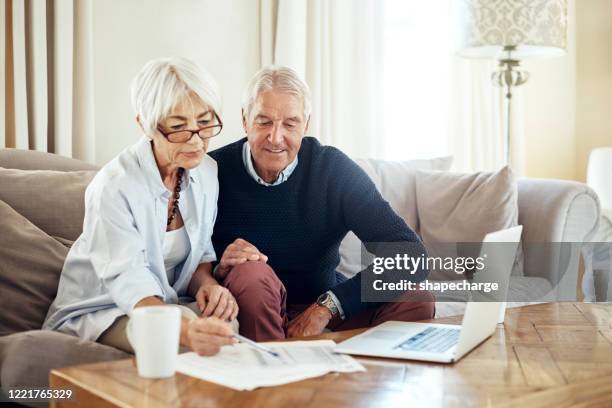 keeping an eye on their finances - wealth planning stock pictures, royalty-free photos & images