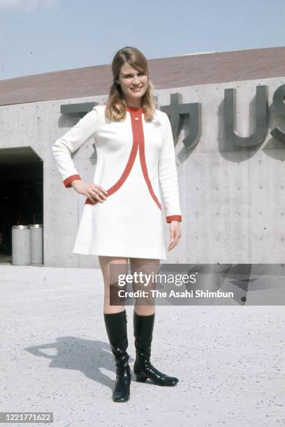 Hostess of the USA pavilion poses for photographs as the Expo '70 continues on April 12, 1970 in Suita, Osaka, Japan.